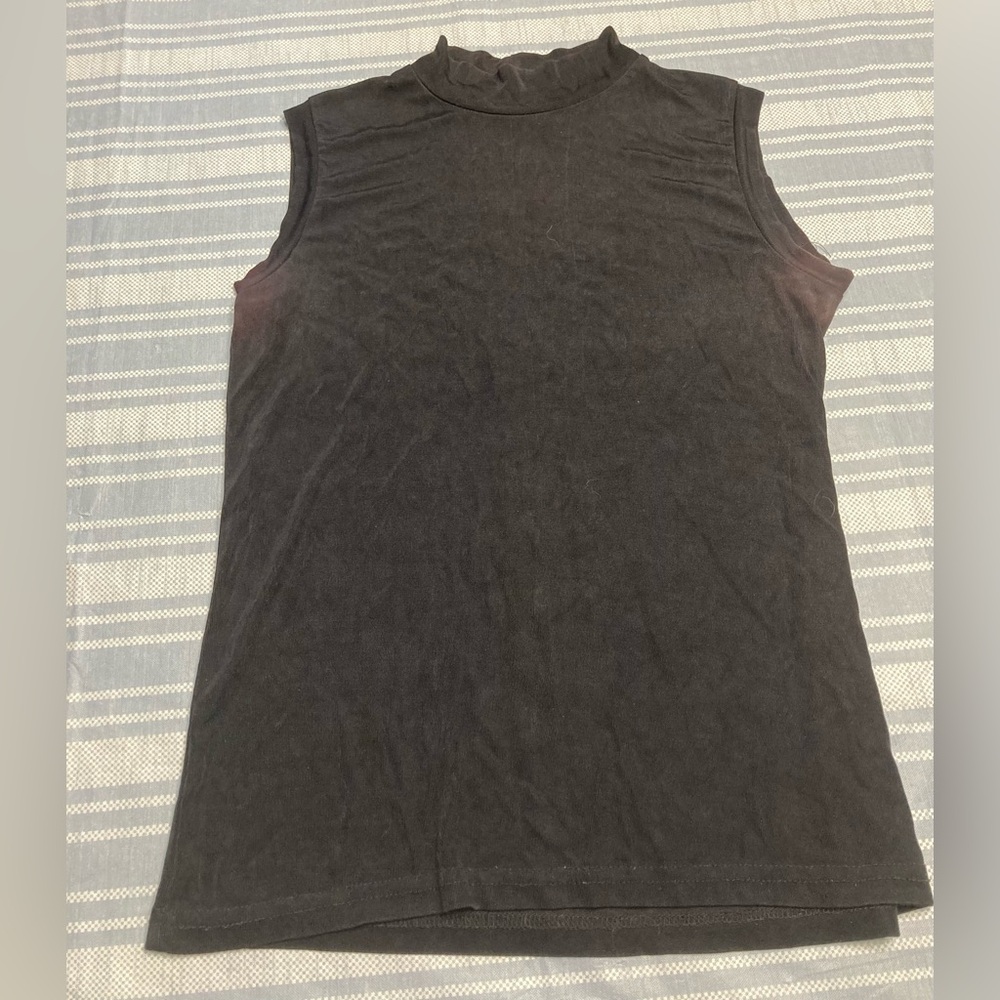 Western Connection black mock-turtleneck sleeveless shirt.